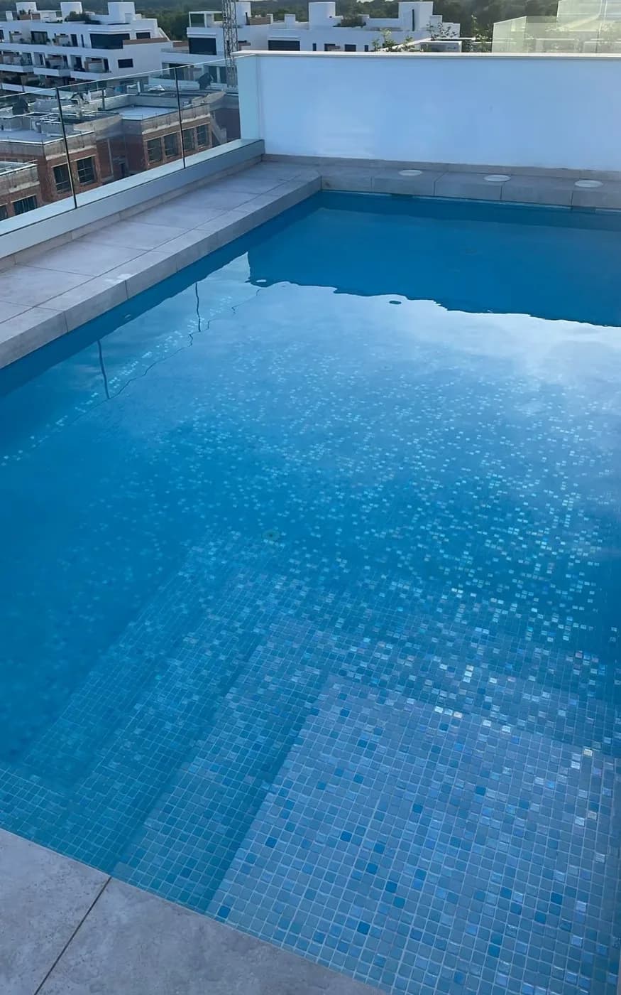 Restored pool with clear water after deep cleaning and chemical rebalancing.