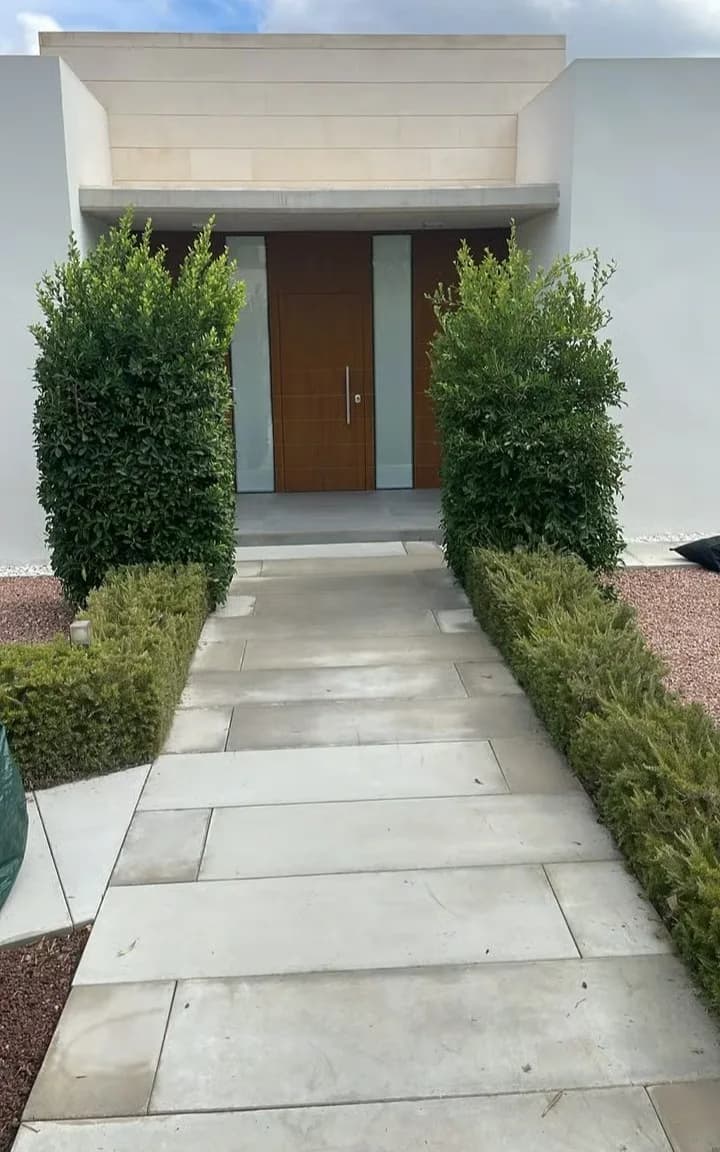 Entrance hedges after trimming, leaving a tidy approach to the villa.